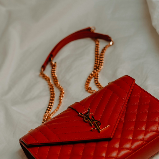 red YSL bag with gold straps 