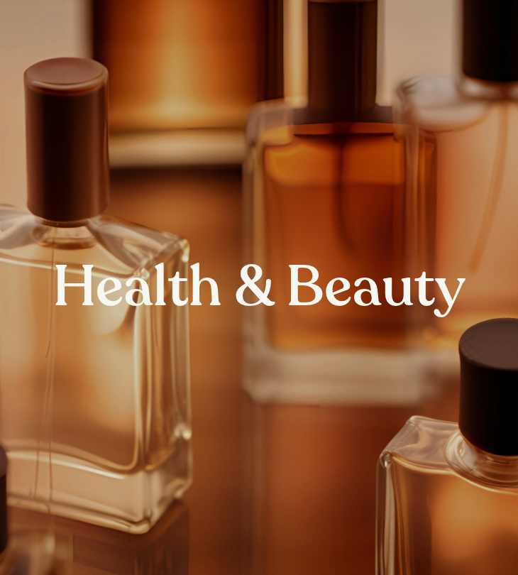 Health & Beauty: glass fragrance bottles in warm amber tones.