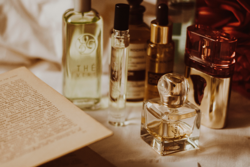 a collection of perfumes on a table