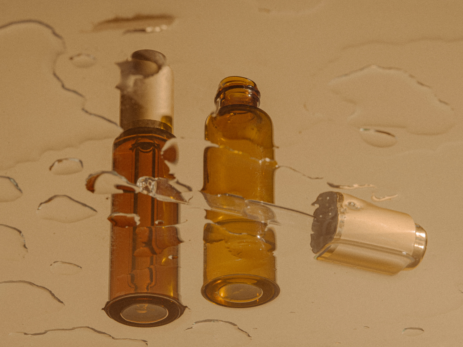 close up of a reflection of skincare bottles