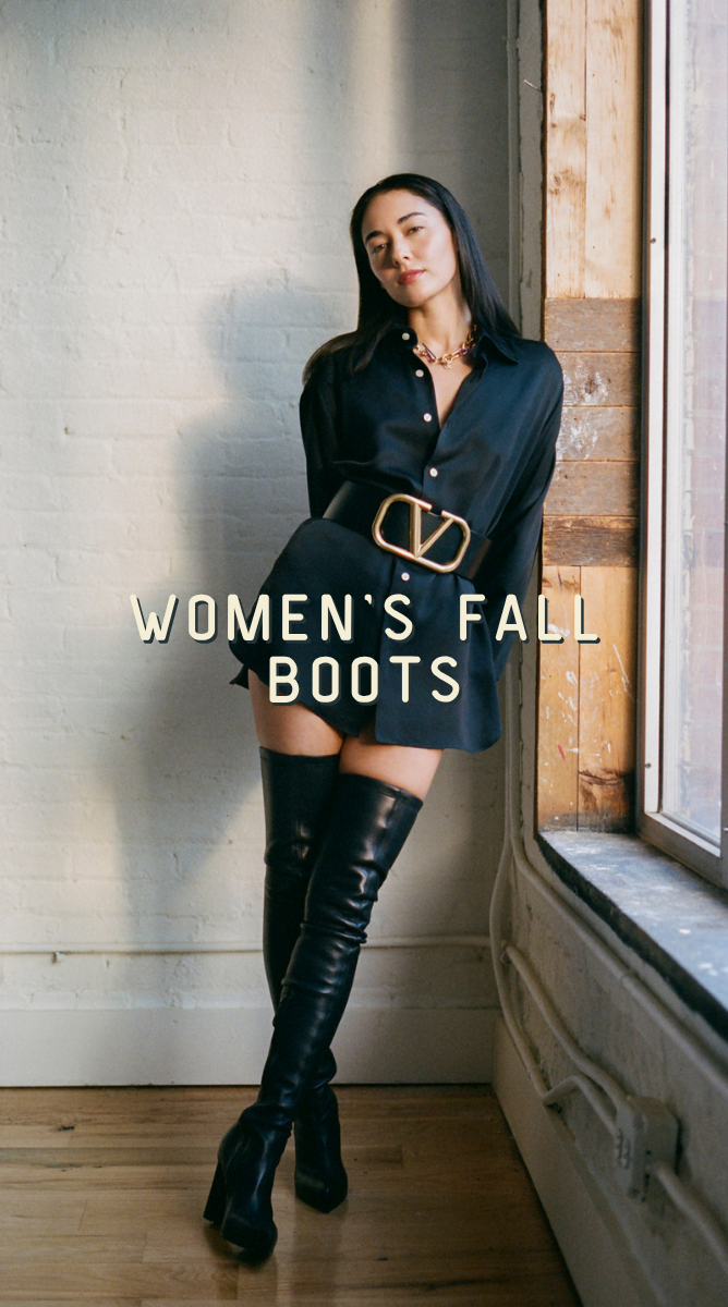 A woman leans against a window in a black shirt dress with a wide belt and black over-the-knee boots. The text 'WOMEN'S FALL BOOTS' is overlaid on the image.