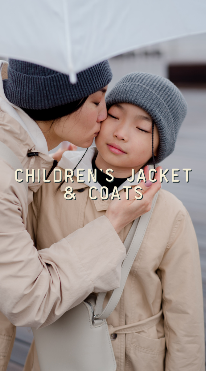 Person kissing a child on the cheek, both wearing matching beige coats and hats.