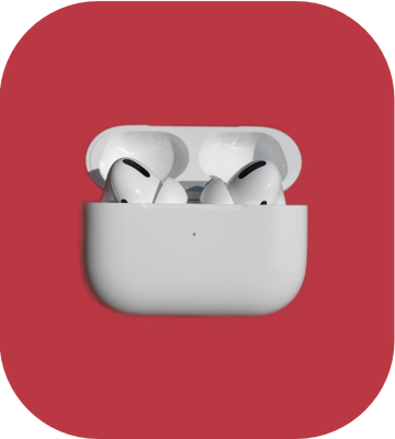 White wireless earbuds in a charging case on a red background