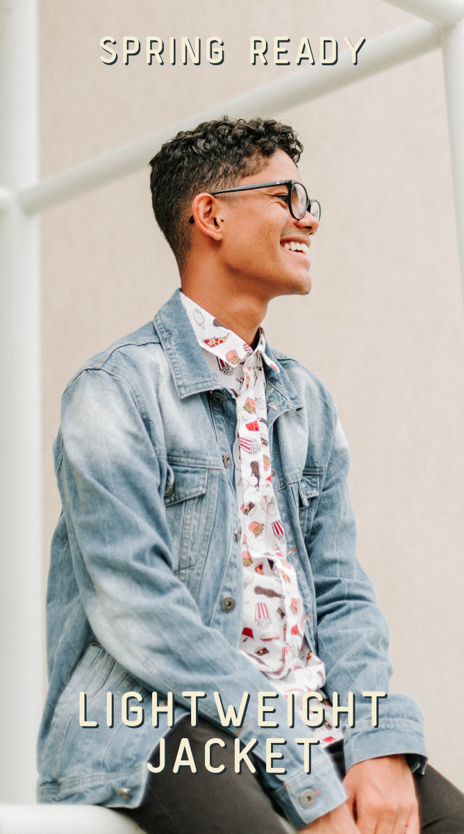 a man wearing a denim jacket and floral shirt sitting